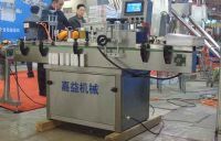 洗洁精贴标机与润滑油侧贴贴标机——济南嘉益贴标机厂产品解析